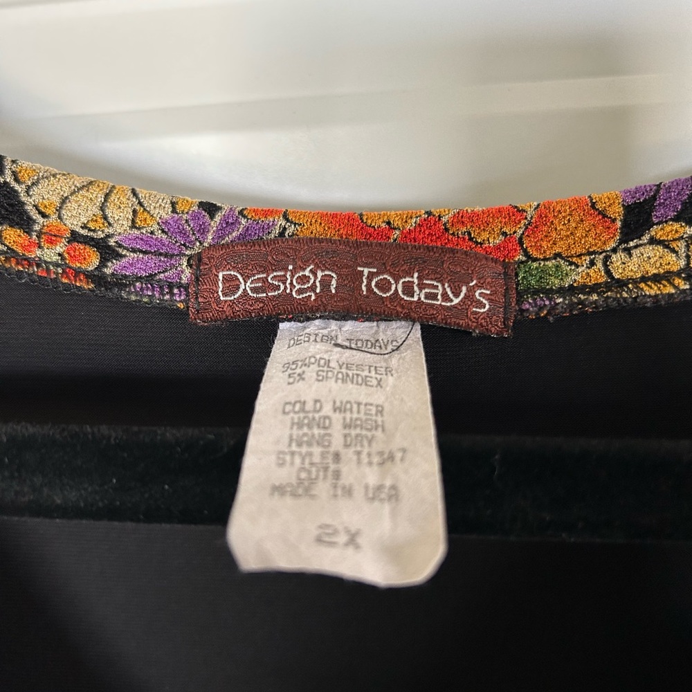 Black top with floral trim. - Picture 9 of 9